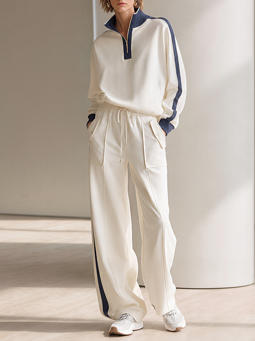 Off-white Half-zip Mock-neck Top And Wide-leg Pants Set With Contrasting Piping.