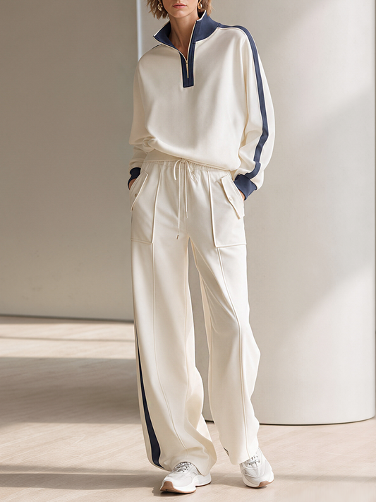 Off-white Half-zip Mock-neck Top And Wide-leg Pants Set With Contrasting Piping.